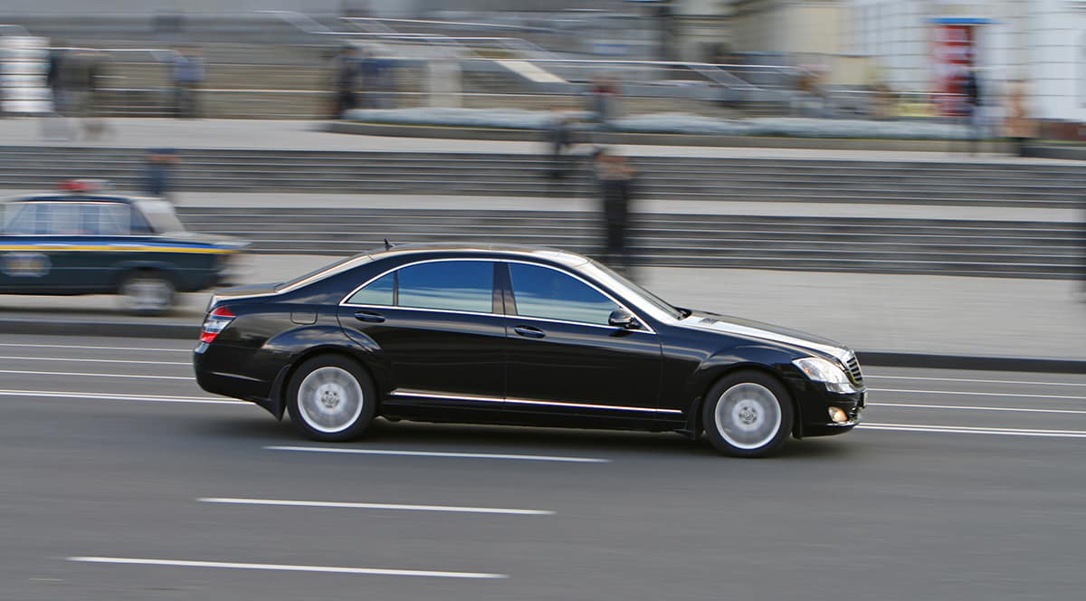 Executive Black car service, black car in the street